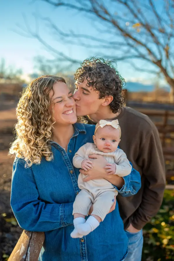 Couple with their baby at a St. George family photo session
