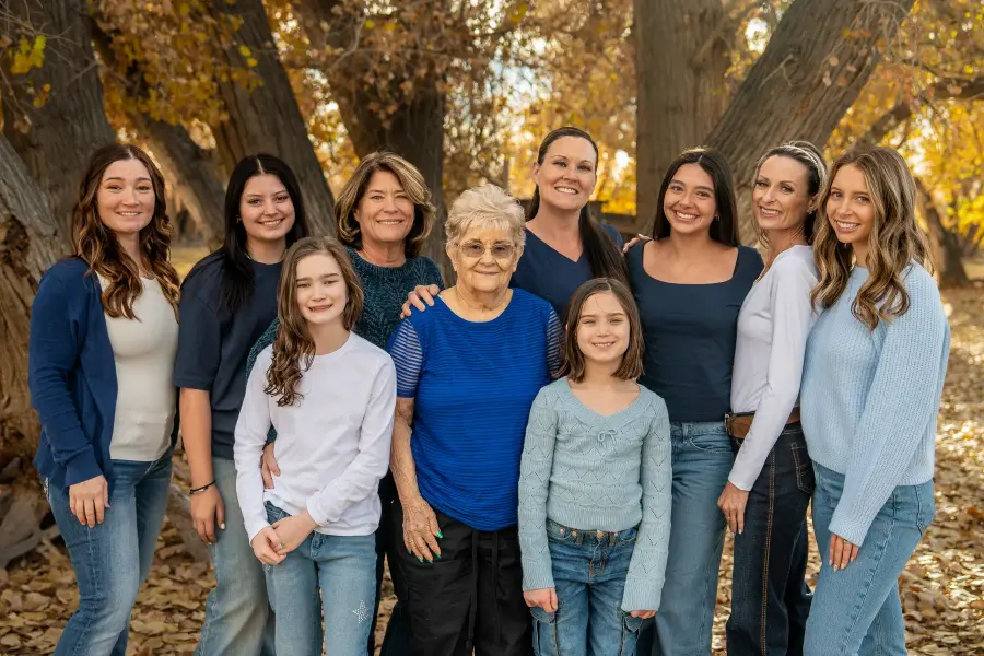 Family of four among fall leaves in St. George, Utah