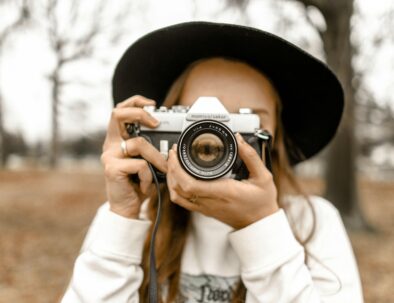 woman photographer with a hat